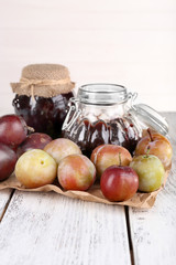 Obraz na płótnie Canvas Plum jam and fresh plums in glass dish
