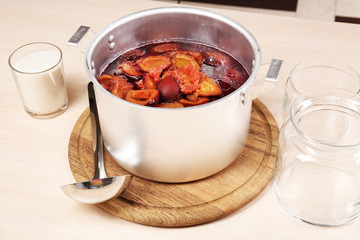 Cooking delicious drain jam in kitchen