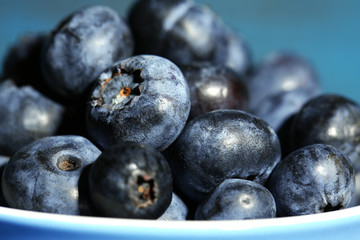 Tasty ripe blueberries, on wooden background