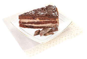 Chocolate cake on plate isolated on white