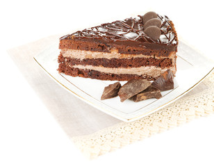 Chocolate cake on plate isolated on white