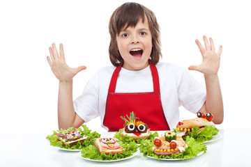 Happy chef with creative food creature sandwiches