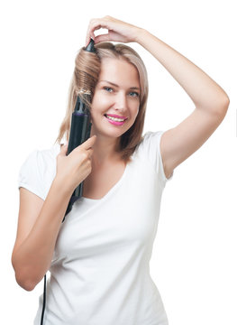 Beautiful girl doing hairstyle with hair brush
