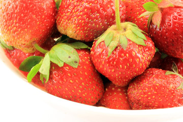 Juicy, ripe strawberries with green Apple in the Cup. Isolated o