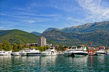 Fototapeta na wymiar Boats and yachts moored in harbor in Budva, Montenegro.