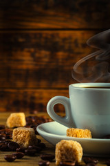Coffee espresso with cane sugar and coffee beans.