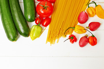 Spaghetti pasta with vegetables on table