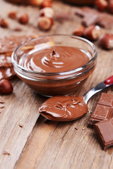 Sweet chocolate cream in bowl on table close-up