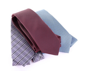 Brown, blue and grey ties on white background isolated