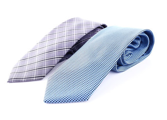 Blue and grey ties on white background isolated