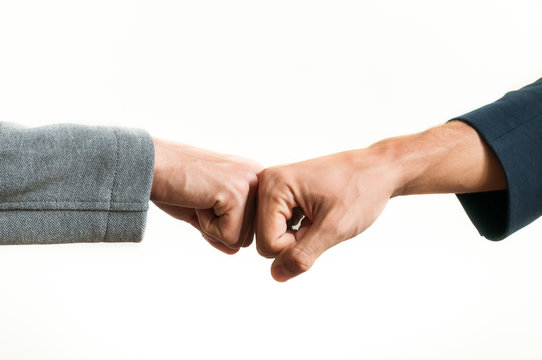 Businessmen fist bump isolated on white