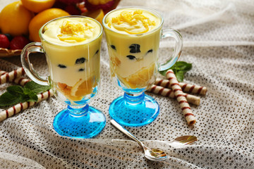 Tasty lemon desserts on table at home
