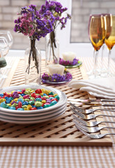 Buffet table with dishware waiting for guests