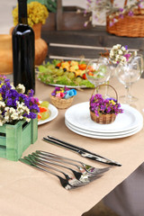 Buffet table with dishware waiting for guests