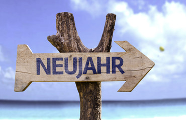 "Neujahr" (In German: New Year) sign with a beach on background