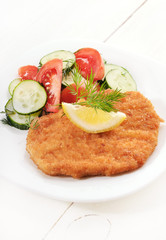 Schnitzel and salad with fresh vegetables