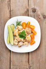 Chicken shish kebab on wooden table
