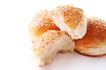 Tasty buns with sesame isolated on white