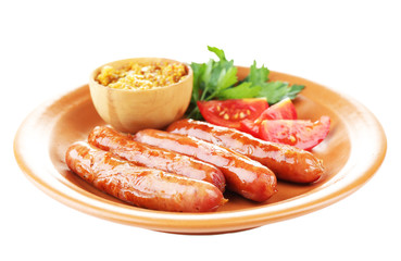 Tasty thin sausages on plate isolated on white