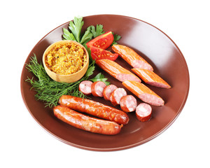 Assortment of tasty thin sausages on plate isolated on white