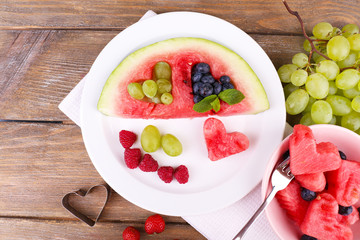 Fresh juicy watermelon slice  with cut out heart shape, filled