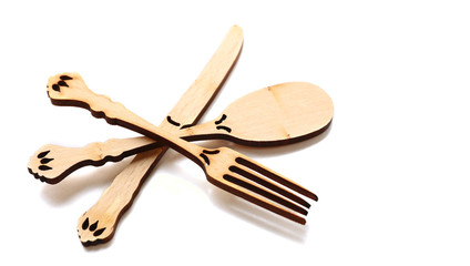 Decorative wooden utensils isolated on white