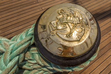 Fototapeta na wymiar mooring rope tied on the bollards of old wooden ship