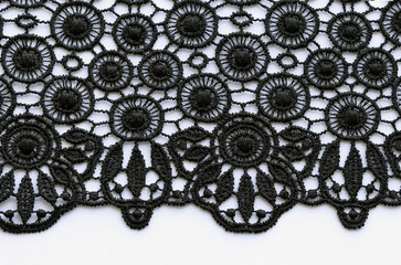 Black flowers and leaves lace material texture macro shot