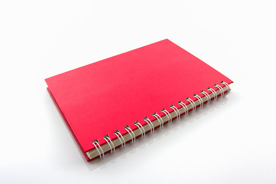 Red book on white background.