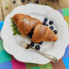 Breakfast, croissant with blueberries
