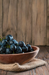 grapes in  wooden plate