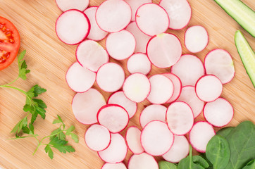 Wooden platter with vegetables.