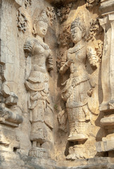 decorated wall with a mythological figure in a Buddhist temple
