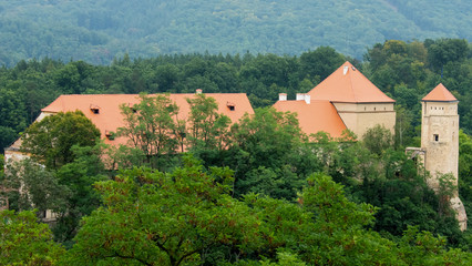 Fototapeta na wymiar Veveri Castle set up in the coutryside and hills - panorama