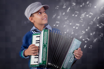 little musician playing the accordion