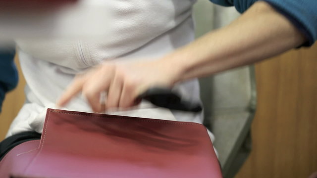 worker hands in a factory manufacturing leather