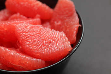 Red Grapefruit in a black bowl