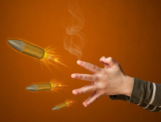 Gun shaped woman hand with bullet