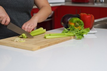 Woman chopping celery