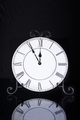 Old antique wall clock isolated
