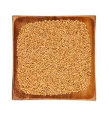 Wheat in a wooden bowl