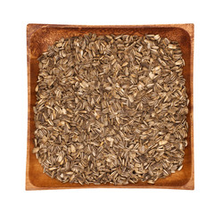 Sunflower seeds in a wooden bowl