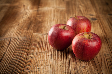 Fresh harvested apples on wood