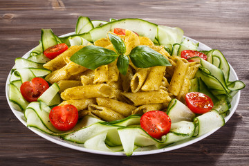 Pasta with pesto sauce, parmesan and vegetables