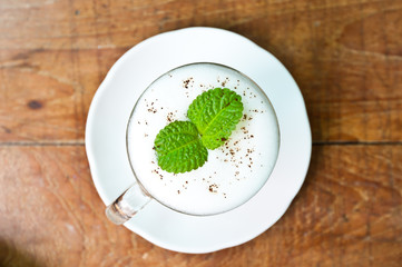 Cappuccino coffee on wood table