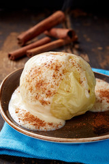 baked apple dessert with vanilla sauce