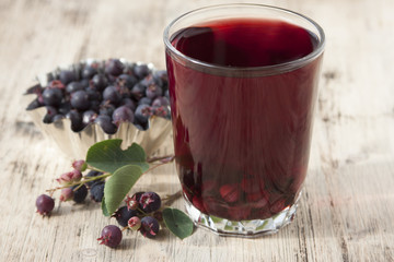 Compote of berries irgi in a glass   and berries irgi in a cup o