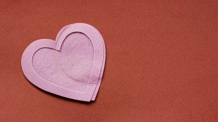 Felt heart frames and shape on paper. Background for Valentine