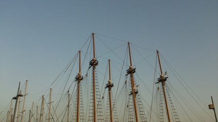Many masts with sky on background