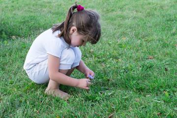 child playing on the grass
